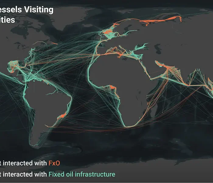 A world map showing 2023 vessel tracks visiting offshore oil facilities; orange lines indicate interactions with FxO, green lines with fixed oil infrastructure. Vessel tracks are concentrated near coasts and major port regions.